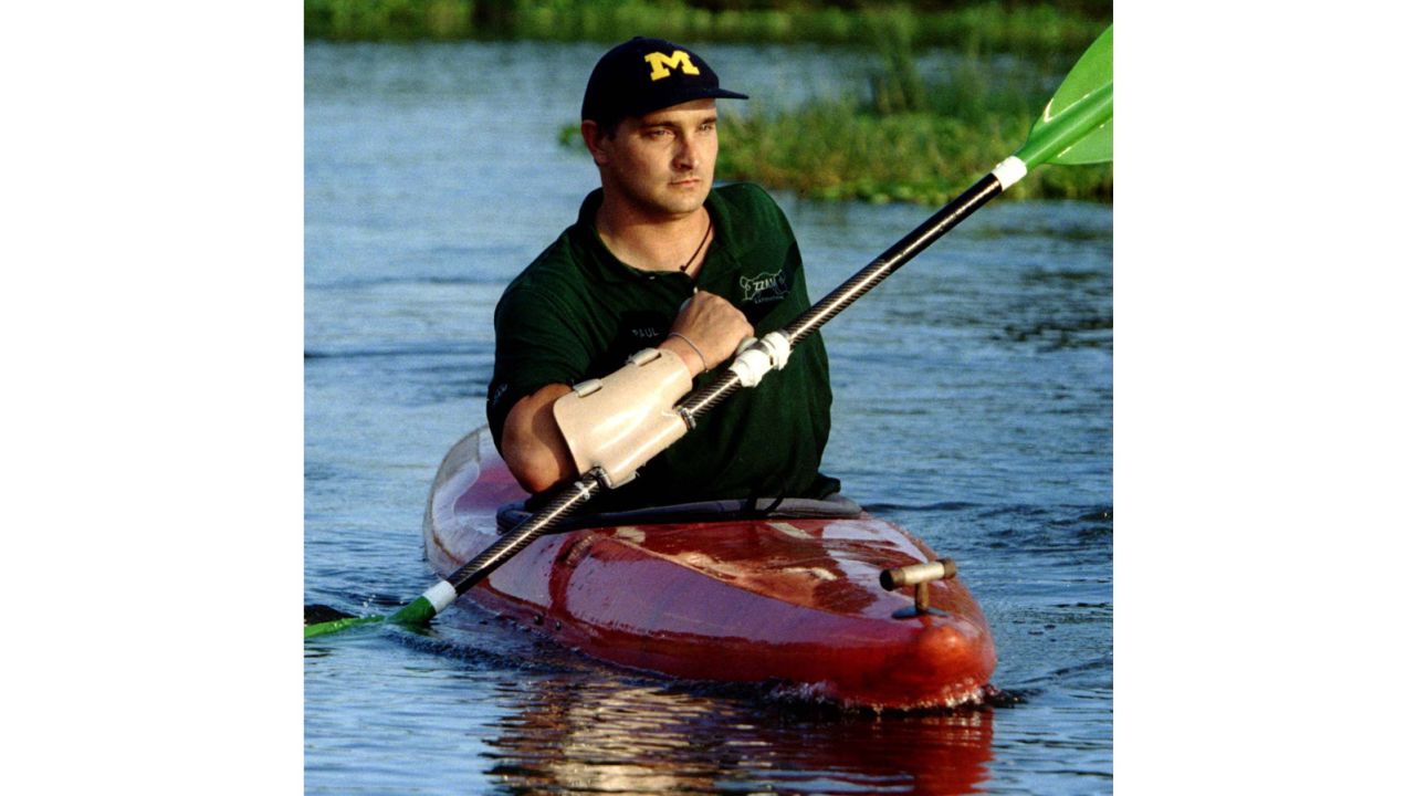 Paul Templer, who lost his left arm in the 1996 hippo attack, paddles a kayak with a specially made paddle two years later to practice for his record-setting Zambezi River descent.
