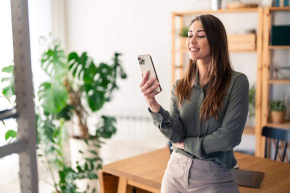 Business woman looking at phone