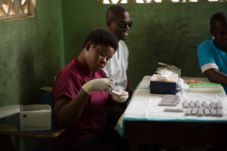 School College Martin Luther in Liberte where a Trasmission Assessment Survey is about to take place. Students, ages 6 and 7 arrive to be tested for LF and Malaria.Various scenes at the TAS.