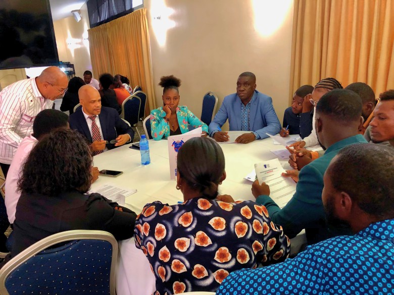 Participants in small groups discussing potential solutions to Haiti’s challenges, focused on the three main points of the Patriotic Congress for National Rescue during its final day in Pétion-Ville on Friday, June 27, 2025. Photo by Juhakenson Blaise/The Haitian Times.
