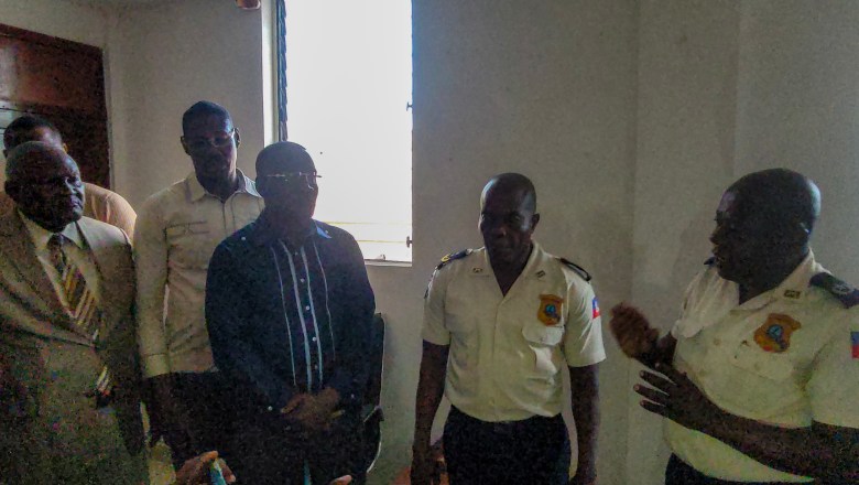 Attendees at the installation ceremony of Artibonite’s new police chief in Gonaïves on July 25, 2025, including from left to right: new Departmental Director Jean Fresnel Beauvoi, Inspector General Joany Canéus and Departmental Delegate Ivens Néréus. Photo by Onès Joseph for The Haitian Times.