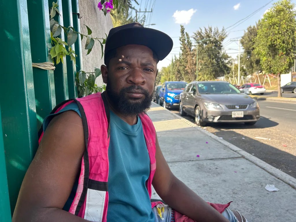Luxène Augustin is seen in Mexico City during his break at the Hospital General de Tláhuac parking lot, where he directs traffic and watches over cars, on March 14, 2025. Photo by Annika Hom for The Haitian Times.