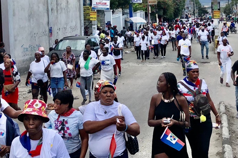 Many women, both religious and non-religious, marched through the streets of Port-au-Prince alongside pastors known as the “3M” to call for peace in Haiti on Saturday, Jan. 3, 2026. Photo by Juhakenson Blaise / The Haitian Times
