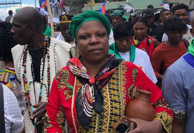 One of the Vodou priestesses accompanying the Haitian Vodou king along the route of the peace march in Haiti, held in Port-au-Prince on Saturday, Jan. 3, 2026. Photo by Juhakenson Blaise / The Haitian Times
