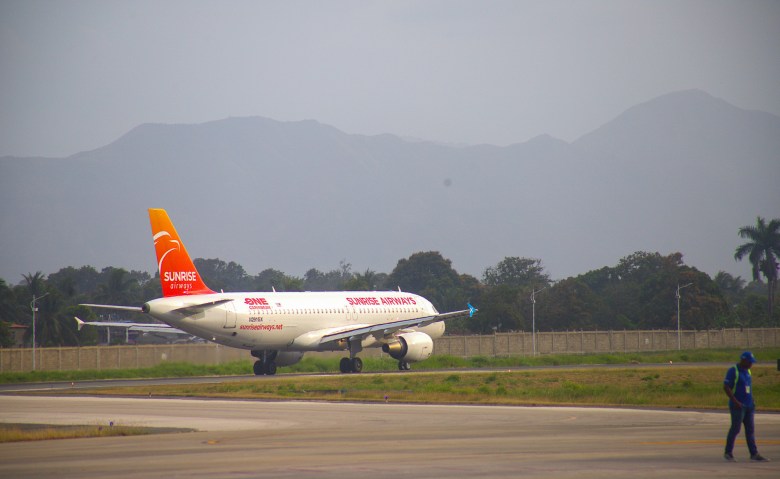 A Sunrise Airways aircraft taxis on the runway before takeoff. Photo by Onz Chéry/The Haitian Times.