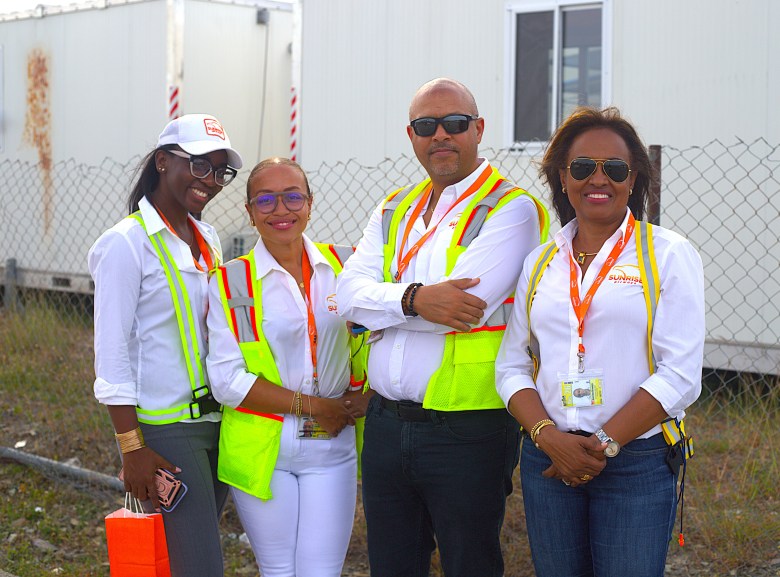 Sunrise Airways staff pose for a photo after boarding. Photo by Onz Chéry/The Haitian Times.